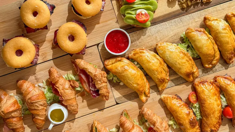 Selection of pastries, filled croissants and mini sandwiches for catering